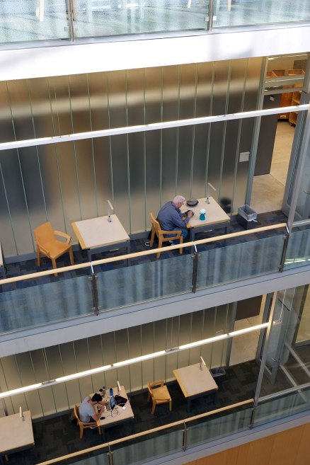 individual study carrels on balconies hanging into the atrium