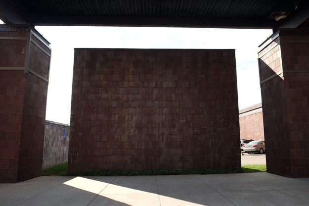 it resembles the monolith in 2001, but it is really just a screen wall hiding the parking lot