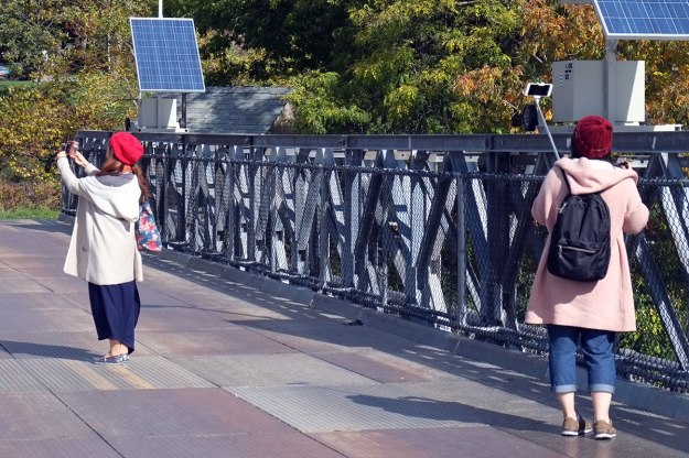 the girl on the left was spinning in circles, taking a selfie movie!